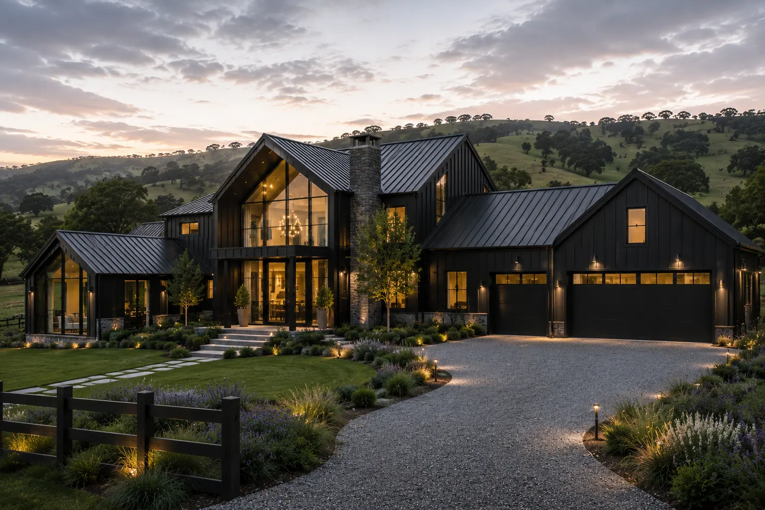 A two-storey home with gabled glazing on a hillside at sunset